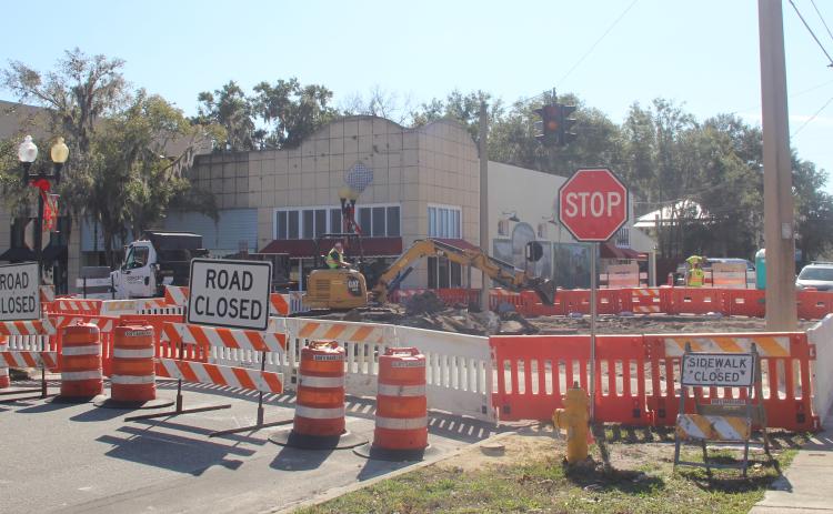 A construction crew works Tuesday to renovate the intersection of Seventh Street and St. Johns Avenue in Palatka.