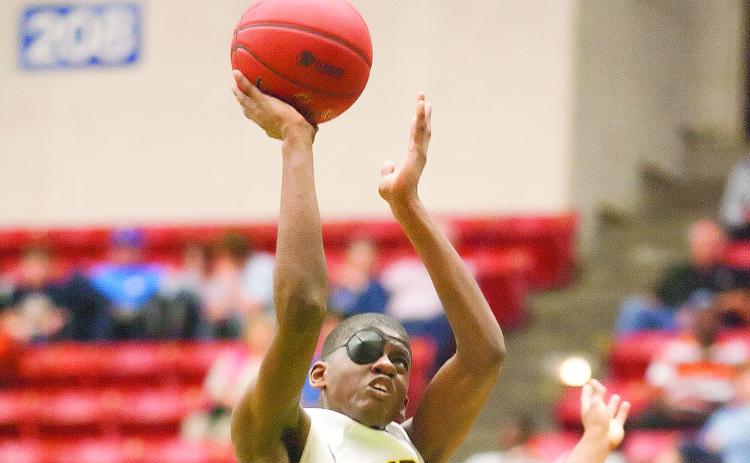 Crescent City’s Gary Mims puts up a shot against Hawthorne in the FHSAA 1A semifinal on Feb. 24, 2015 at the Lakeland Center. (Daily News file photo)
