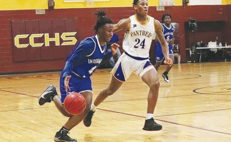 Interlachen’s Deon Fells pushes the ball up the court last Thursday night against Palatka’s Mario Bryant in the Rams’ 54-39 win over the Panthers in the Pooh Bear Williams Classic. (RITA FULLERTON / Special to the Daily News)