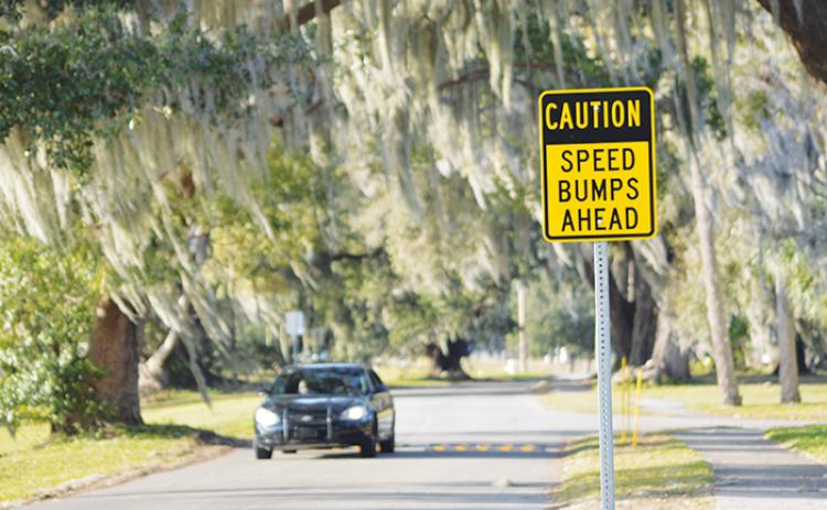 A car makes its way over the temporary speed bumps along Grand Rondo and Magnolia Avenue in Crescent City on Tuesday. 