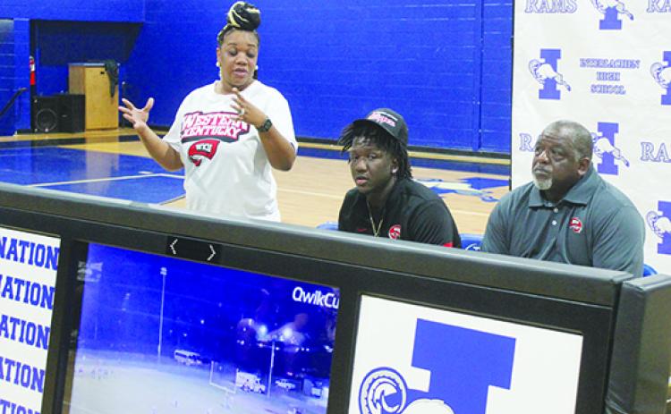 Latonya Allen talks about her son, Reggie Jr., after he chose to go to play college football at Western Kentucky University, while Reggie’s father, Reggie Allen Sr., listens. (MARK BLUMENTHAL / Palatka Daily News)