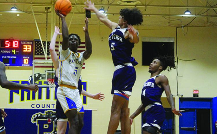 Palatka’s Trenton Williams (left) has been a major force for his team this winter. (MARK BLUMENTHAL / Palatka Daily News)