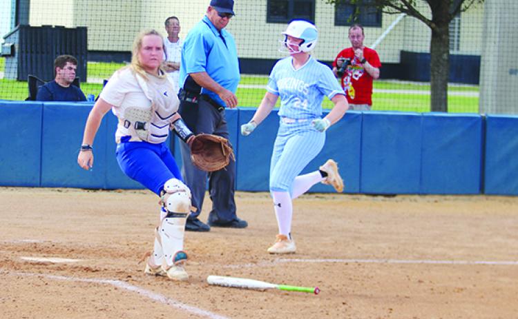 St. Johns River State College’s Madison Duncan scores a fourth-inning run as Eastern Florida State catcher Samantha Clark awaits the throw. (MARK BLUMENTHAL / Palatka Daily News)