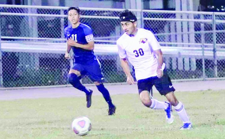 Crescent City’s Felipe Serrano-Santana (right) scored the only goal for the Raiders in their 3-1 district semifinal loss to Pierson Taylor. (RITA FULLERTON / Special to the Daily News)