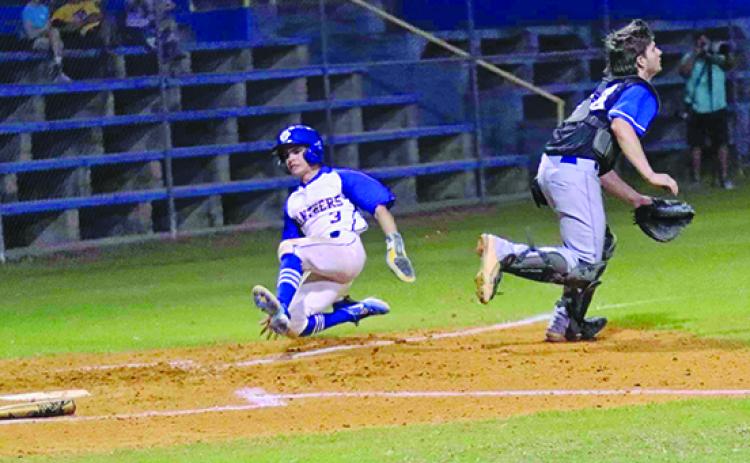 Palatka’s Tanner Ortiz scores a first-inning run as Interlachen catcher Miles Hoffman goes after the throw. (RITA FULLERTON / Special to the Daily News)