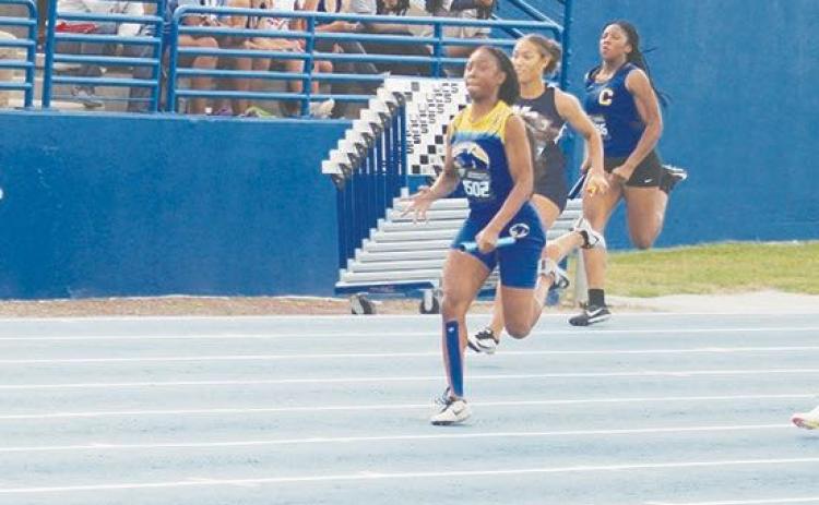 Senior Samiya Edwards runs the anchor lap of the Palatka Junior-Senior High girls track team’s 4x100 relay team last May at the University of Florida. (MARK BLUMENTHAL/Palatka Daily News)