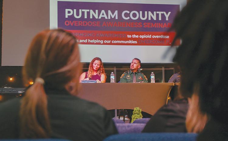 Dr. Rachel Sanchez and Putnam County Sheriff’s Office Maj. Scott Surrency listen to questions about substance use disorder.