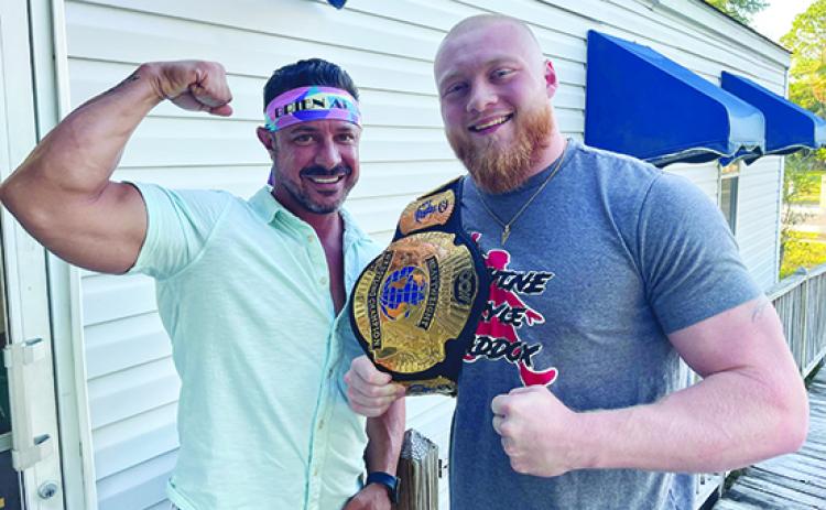 Wrestlers Brien Adam (left) and CCW champion Bryce Maddox will be part of the wrestling program held at Grace Fellowship Church’s gymnasium tonight. (Submitted / BRIEN ADAM)