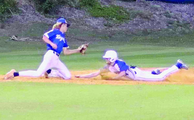 Palatka’s Micah Harper slides safely into third base during the third inning as Keystone Heights third baseman Austin Musgrove is late with the tag during Tuesday’s game at the Azalea Bowl. (RITA FULLERTON / Special to the Daily News)