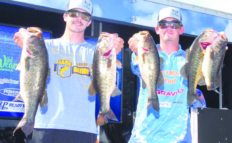 Austin Peters (left) and Syler Prince of Palatka show off some of their catches over the weekend at the Palatka City Dock. The pair were high points leaders for the year in the BASS Nation Juniors/High School Anglers. (GREG WALKER / Daily News correspondent)