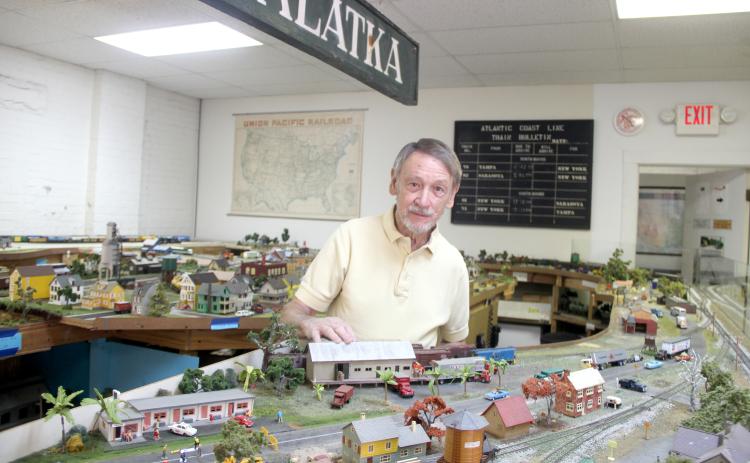 Howard Blasczyk, vice president and treasurer of the Palatka Railroad Preservation Society, shows the Rails of Palatka display that depicts areas around Palatka in the 20th Century. – TRISHA MURPHY/Palatka Daily News 