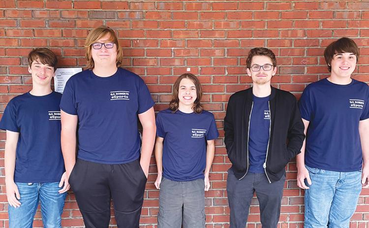 The Q.I. Roberts Junior-Senior High School esports team placed first in a national championship this month under the guidance of their coach and computer science teacher, Chris Cantrell, second from right.