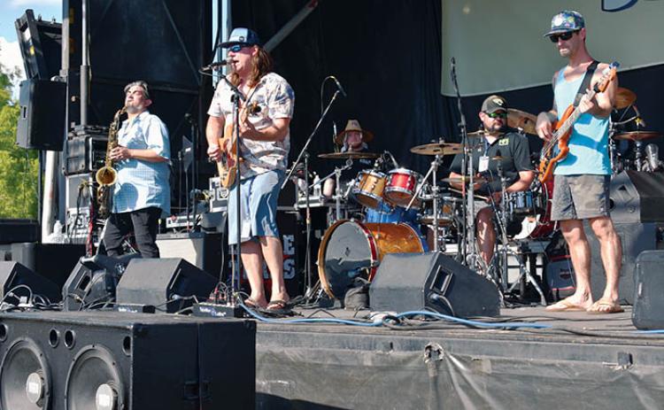 The band Paper City Hustlers performs on the second day of the 2022 Blue Crab Festival at the Palatka riverfront.