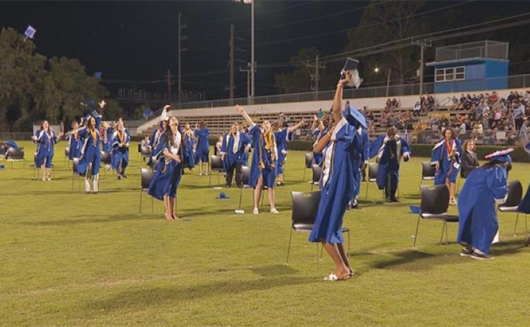 Photo courtesy of the Putnam County School District   Q.I. Roberts Junior-Senior High School graduates celebrate completing high school during their commencement ceremony Saturday evening.