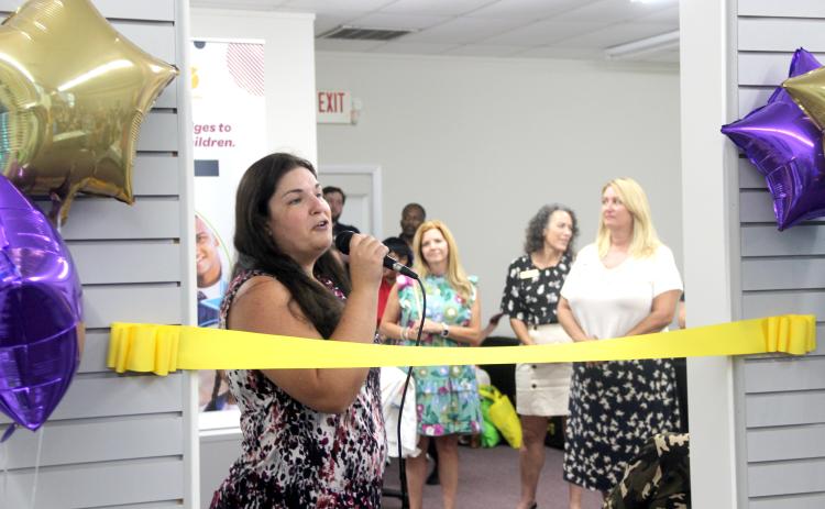 TRISHA MURPHY / Palatka Daily News. Jacqueline Cox, director of the Putnam County Wellness Center, welcomes guests to the center’s unveiling Thursday at 320 S. State Road 19 in Palatka.