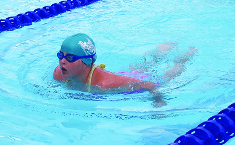 Putnam Sharks swimmer Kyra Vinson competes in the 50-yard breaststroke during Saturday’s opening swim meet at the Putnam Aquatic Center. (MARK BLUMENTHAL / Palatka Daily News)