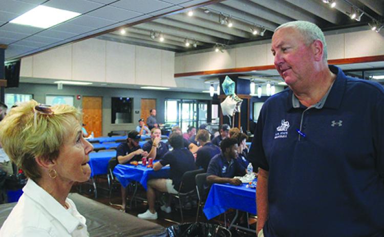 St. Johns River State College baseball coach and athletic director Ross Jones talks with Joyce Oliver at the Vikings Center Monday before the celebration of the Vikings’ trip to Oklahoma and Final Four finish in the National Junior College Athletic Association Division II World Series. (MARK BLUMENTHAL / Palatka Daily News)