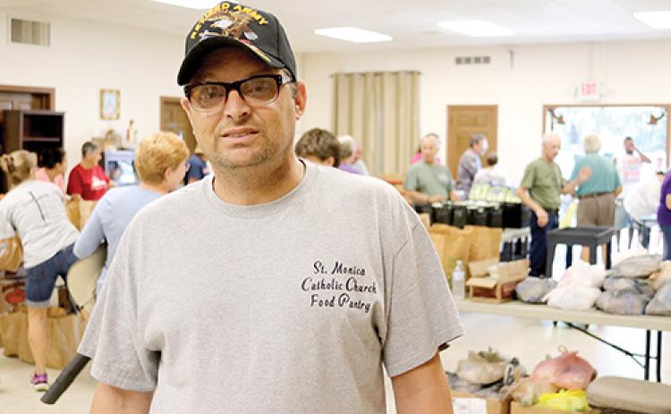 Army veteran Kevin Donnelly works part time as the food pantry manager for St. Monica Catholic Church while also working for Lowe’s in St. Augustine.