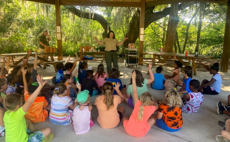 Photo submitted by Diana Drew. Putnam County children listen to a speaker at Ravine Gardens during Camp Common Ground. 