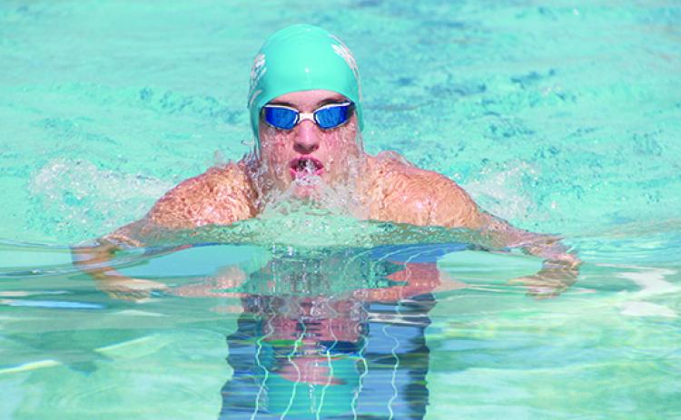 Putnam Sharks swimmer Parker Gill moves through the water to one of his three victories in the 15-18-year-old division Saturday at Aberdeen Amenities Center. (COREY DAVIS / Palatka Daily News)