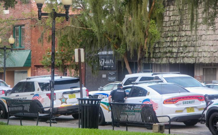 SARAH CAVACINI/Palatka Daily News. Law enforcement officers are parked on the 400 block of St. Johns Avenue on Wednesday evening.