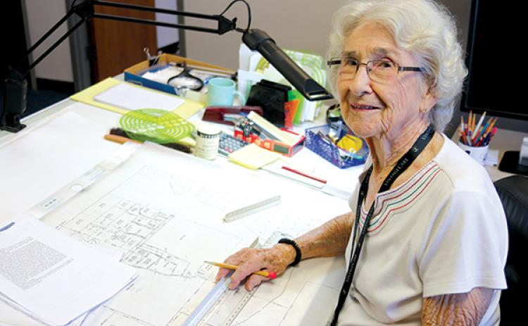 TRISHA MURPHY/Palatka Daily News -- Palatka resident Pat Bennett sits at her desk, where she has worked as a mapper for the Putnam County Property Appraiser’s Office for 42 years and counting.