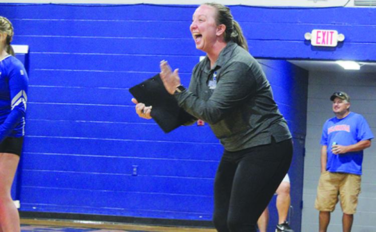 Interlachen volleyball coach Tonya Troiano gets excited after her team scored its 24th point in the third set of Thursday’s straight-set sweep over Florida D&B. (MARK BLUMENTHAL / Palatka Daily News)