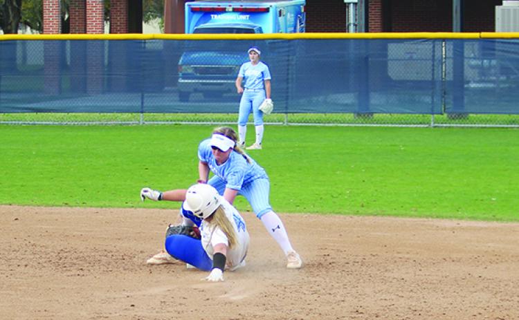 St. Johns River State College softball shortstop Kendall Catherwood tags out East Florida State College (and Palatka High product) Samantha Clark on a steal attempt during a game Feb. 21. (MARK BLUMENTHAL / Palatka Daily News)