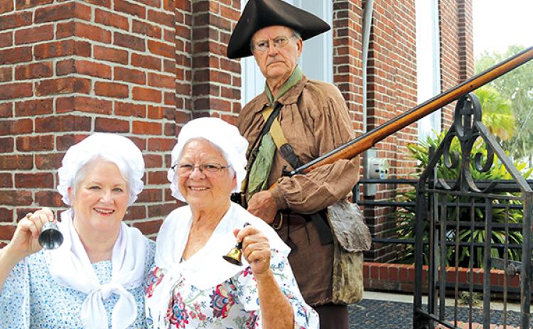 TRISHA MURPHY/Palatka Daily News – Meri Rees, left, Suzanne Wolding, center, and Lyle Wolding are dressed up in anticipation of Constitution Day on Saturday.