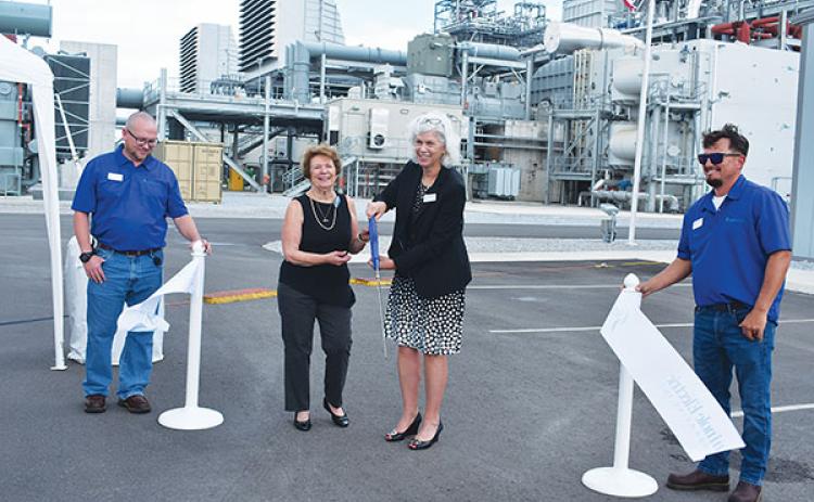 BRANDON D. OLIVER/Palatka Daily News – Susie Reeves, second from left, the president of Seminole Electric Cooperative’s board of trustees, and Lisa Johnson, second from right, Seminole's CEO and general manager, cut the ribbon to launch the Seminole Combined Cycle Facility on Wednesday.