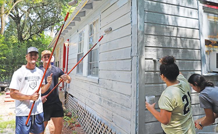 Photo submitted by Susan Kessler – St. Johns River State College Viking baseball and softball student-athletes Ben Barrow, Andon Lewis, Princess Arredondo and Alyssa Vallad volunteer to paint a local resident’s home in partnership with the United Way.