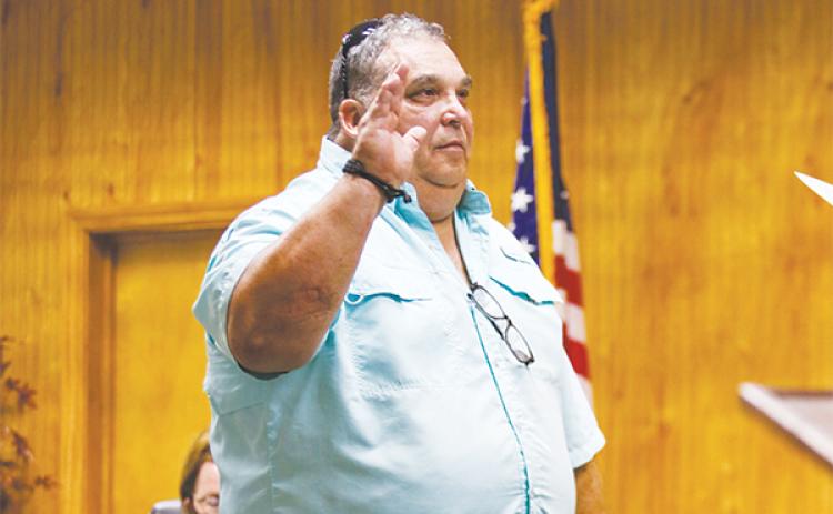 File photo – Former Crescent City Commissioner C.J. Bailey gets sworn in during a meeting in November 2022.
