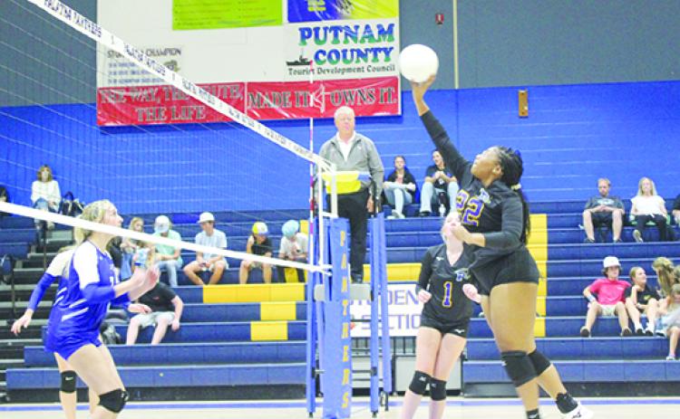 Palatka’s Tanaja Martin hits the ball over the net during the second set of Friday’s volleyball match against Peniel Baptist at the newly minted John L Williams Athletic Center. (MARK BLUMENTHAL / Palatka Daily News)