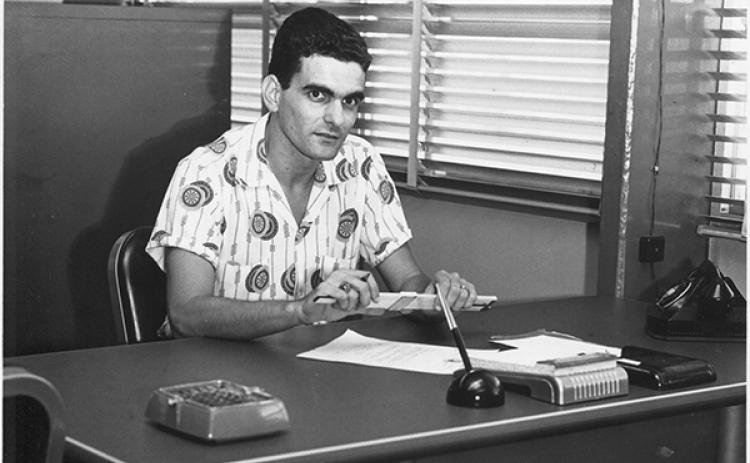 Danny Martinez sits at his desk on his first day of work in 1954 at Hudson Pulp & Paper Corp. in Palatka. Hudson was eventually acquired by Georgia-Pacific, where he retired in 1992. 