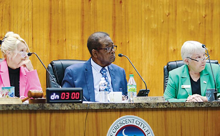 SARAH CAVACINI/Palatka Daily News – From left, Crescent City Mayor Michele Myers and Commissioners Harry Banks and Cynthia Burton listen to opinions about reimbursing Myers and Burton for their legal fees.