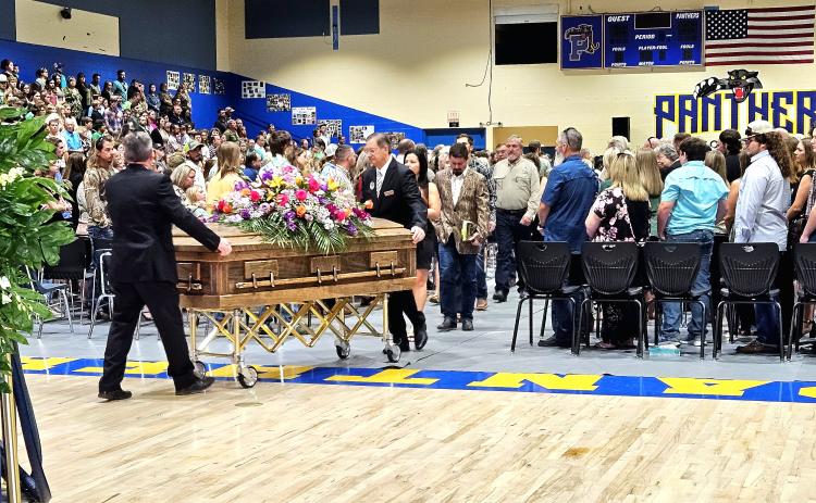 BRANDON D. OLIVER/Palatka Daily News – Baylee Holbrook's casket is led out of Palatka Junior-Senior High School, where her funeral took place Saturday afternoon.