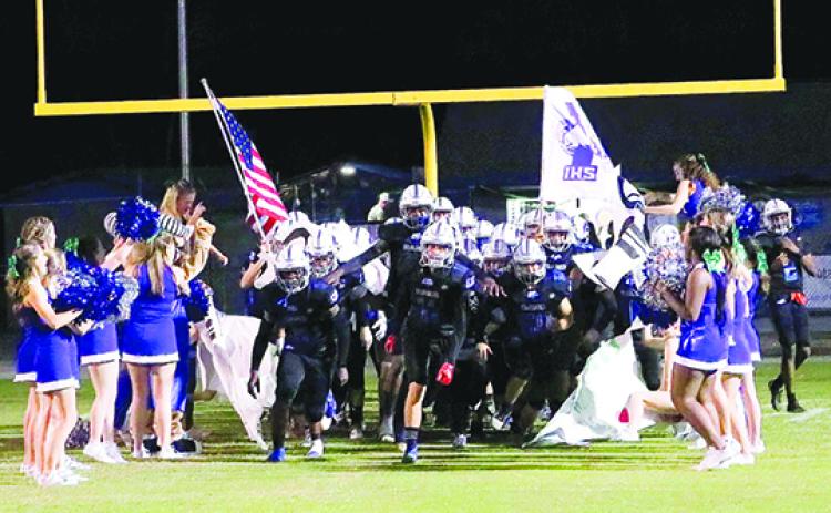 Interlachen comes through a banner before last week's game with Pierson Taylor. The Rams have now won two straight games after an 0-5 start. (RITA FULLERTON / Special to the Daily News)