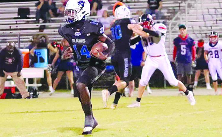 Interlachen’s Kemontae Nixon looks for running room during the Rams’ 20-12 win over Pierson Taylor last week. (RITA FULLERTON / Special to the Daily News)