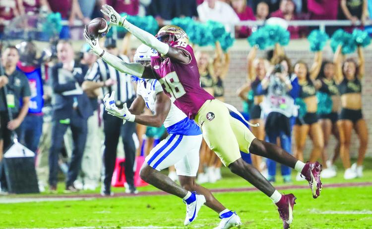 Florida State’s Shyheim Brown jumps in front of Duke’s Jontavis Robertson for an interception in Saturday’s victory in Tallahassee. (GREG OYSTER / Special to the Daily News)