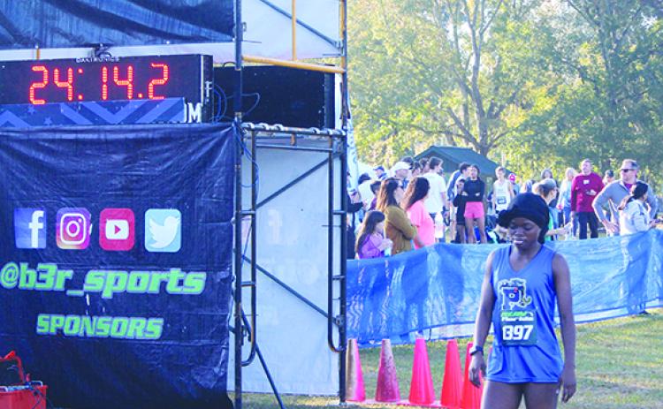 Palatka's Ymira Passmore crosses the finish line in 24:11 in the Region 1-2A championship at Alligator Lake Park in Lake City Thursday. (MARK BLUMENTHAL / Palatka Daily News)