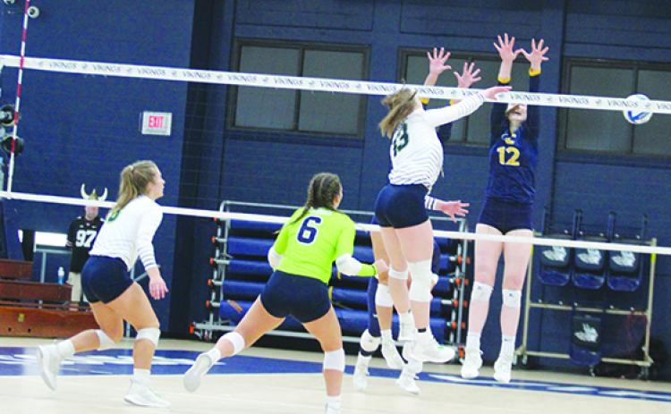 St. Johns River State College’s Becky Thiem (13) puts down a kill against Gulf Coast State’s Abigail Willis during the match at Tuten Gymnasium on Oct. 14. (MARK BLUMENTHAL / Palatka Daily News)