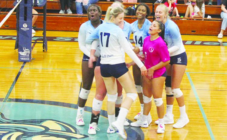 Dariana Luna (at right in dark-colored shirt) and her St. Johns River State College teammates celebrate a victory over Pensacola State on Oct. 8, 2021. (MARK BLUMENTHAL / Palatka Daily News)