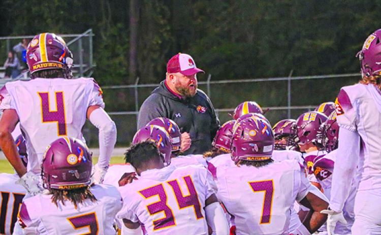 Crescent City interim football coach Robert Ripley talks to his players before their final game against Orange Park Ridgeview on Nov. 3. (RITA FULLERTON / Special to the Daily News)