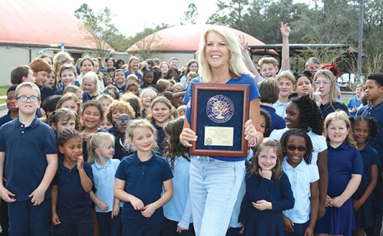 TRISHA MURPHY/Palatka Daily News – Principal Jacqueline England holds a plaque the Children’s Reading Center Charter School in Palatka received after being named a 2023 Blue Ribbon School of Excellence.
