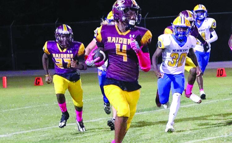 Crescent City receiver Lentavius Keenon rambles for yardage in a game against Newberry on Oct. 27. (RITA FULLERTON / Special to the Daily News)