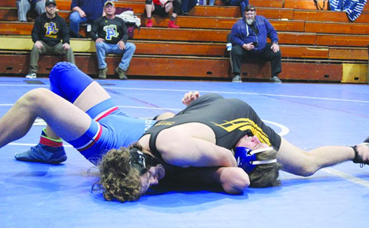 Palatka’s Blake Young (top) gets set to pin Keystone Heights’ Seth Fernandez in the 150-pound match. (MARK BLUMENTHAL / Palatka Daily News)