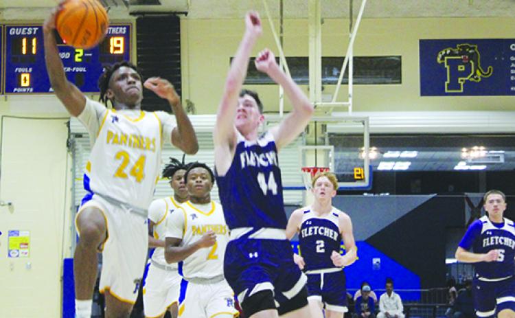 Palatka's Tommy Offord (24) seen going to the basket on Wednesday night against Neptune Beach Fletcher, scored 16 points in helping the Panthers knock off Palm Coast Matanzas, 79-68, at the Jarvis Williams Holiday Boys Basketball Classic Thursday night. (MARK BLUMENTHAL / Palatka Daily News)