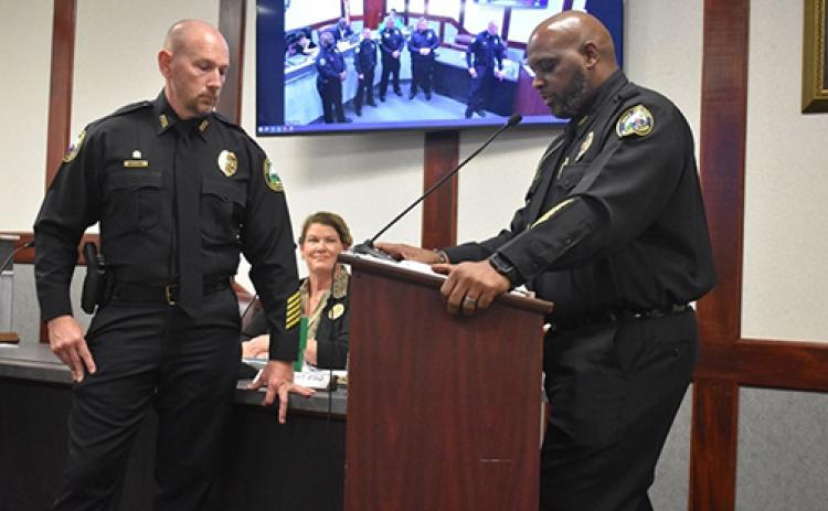 BRANDON D. OLIVER/Palatka Daily News. Palatka Police Department Chief Jason Shaw (right) recognizes Assistant Chief Matt Newcomb (left) who was promoted on Thursday.