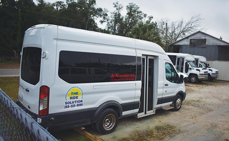 Ride Solution vans are parked at the company’s depot on 10th Street in Palatka.
