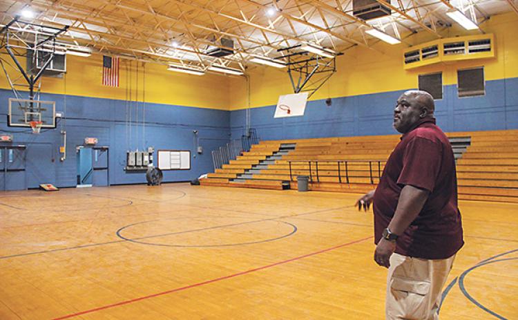 SARAH CAVACINI/Palatka Daily News – Palatka Community Affairs Director Eddie Cutwright explains what needs to be repaired in the former Jenkins Middle School gym before the facility can open as a community center.